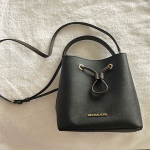 Michael Kors black purse with brown logo’ed handle and strap